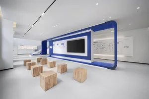 Modern office space featuring wooden furniture and geometric design elements.