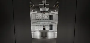A modern retail space with a metal counter and displays.