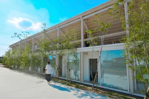 Modern office space with glass walls and balcony