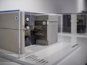 Modern exhibition featuring metal and concrete blocks