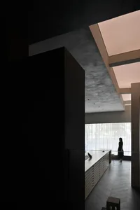 A modern office interior with concrete materials and a minimalist design.