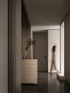 A minimalist design space featuring natural stone surfaces and a serene ambiance.