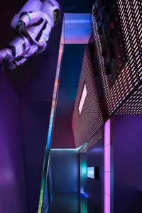 A minimalist interior with metallic accents and a futuristic atmosphere.