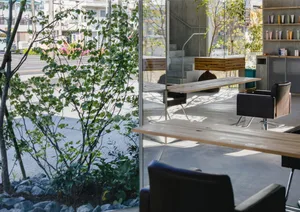 A modern commercial space featuring a mix of materials and minimalist design.