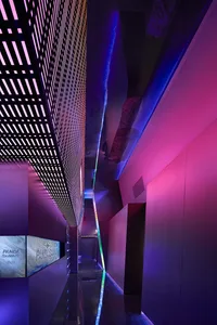 Modern interior design with metallic elements and neon lighting effects