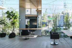 A modern office space with concrete and glass materials and minimalist design.