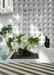 A modern architectural space featuring a concrete and moss-lined planter with a green plant and a black abstract sculpture, s