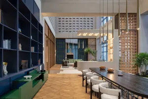 A modern living room with a wooden floor and contemporary furniture.