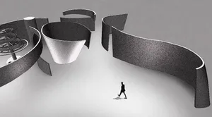 Person walking in front of a modern, minimalist architectural structure made of metallic materials.