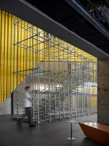 A large industrial structure made of metal in an indoor environment.