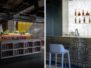 Modern food market with a display of fruits and vegetables on a wooden stand, complemented by marble accents.