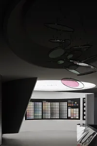 A modern interior space featuring a color chart display with various color swatches.