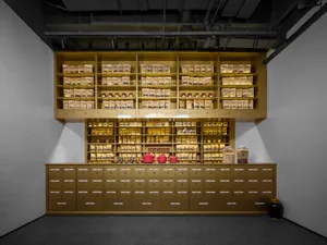 A modern retail interior featuring wooden storage units filled with various goods.