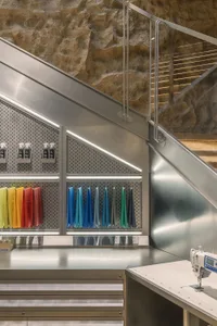 An industrial workbench with metal surfaces and glass accents.