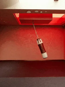 A minimalist designed punching bag hanging from a ceiling.