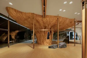 A modern art deco interior featuring a large wooden sculpture as a central focal point.