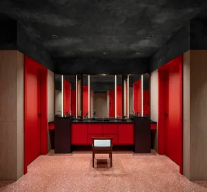 A modern bathroom featuring red material.