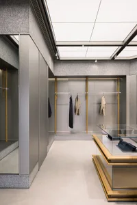 Modern, minimalist living space with concrete walls and floors.