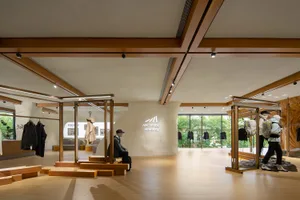 Modern retail store with wooden beams, concrete accents, and glass displays