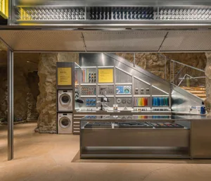 Industrial-style metal shop interior with various tools and equipment on display.