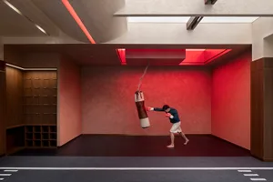 Boxing gym with a concrete floor and red lighting
