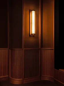 An industrial-style interior featuring a metal wall-mounted light fixture.