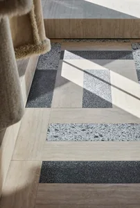 Modern floor pattern featuring concrete tile with varied textures and colors.