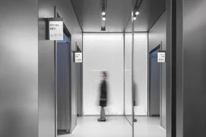 Modern fashion retail store with glass walls and metallic accents