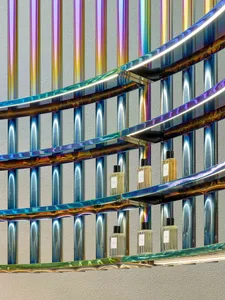 Modern interior design featuring metallic, iridescent finishes and circular stairwell
