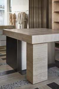 Modern console table made of marble in a contemporary interior design setting.