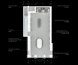 Floor plan of a modern commercial space with concrete walls, glass storefronts, and metal furniture.