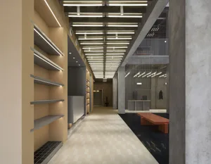 Industrial storefront with exposed concrete walls and a minimalist design.