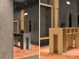 A modern, industrial retail storefront with wooden shelving, concrete walls, and glass display cases.
