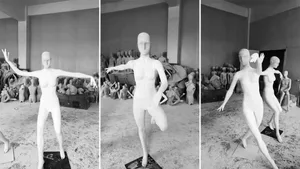 Several white plastic female mannequins in a workspace environment.