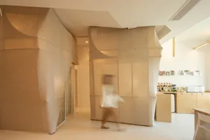 A minimalist interior with textured fabric walls