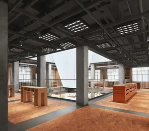 Modern office space featuring concrete walls and floors with contemporary furniture.