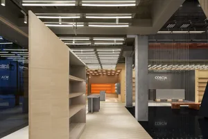 Modern retail storefront with a concrete exterior and minimalist design.