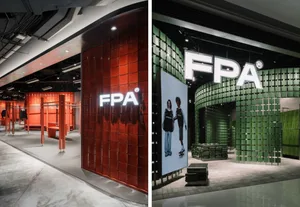 Modern retail storefront with red metal tiles and signage reading 'FPA'.
