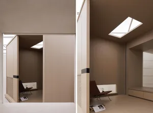 Modern residential space with minimalist design, soft wood paneling, and natural light.