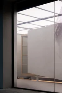 Modern interior space featuring a glass partition wall