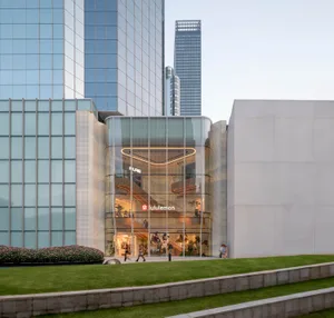 A modern retail storefront with glass walls and a minimalist design.