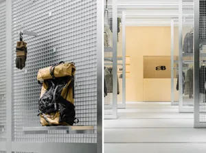 A modern storefront featuring a combination of glass and metal materials.