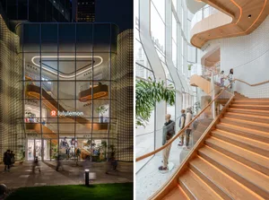 A modern retail storefront featuring glass walls and wooden accents.