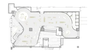 Floor plan of an open-plan workspace with wooden furniture.