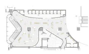 Floor plan of a modern office space with open-plan workstations, meeting rooms, and a central atrium.