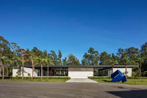 A modern building featuring a combination of metal, concrete, and glass materials.