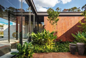 Modern exterior of a house with a combination of materials like glass and metal.