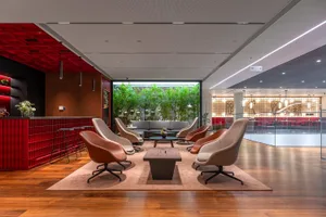 A modern lobby featuring concrete and wooden elements.