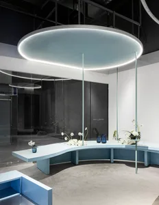 A minimalist display area featuring glass and concrete materials within an architectural setting.