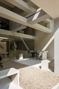Modern interior design of a cafe with concrete and glass materials.